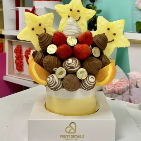 Classic fruit bouquet with smiling pineapple stars, chocolate-covered strawberries, and orange slices — handcrafted by Frutidetails Miami