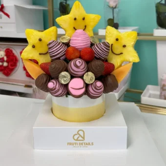 Fruit bouquet smile festival with chocolate covered strawberries, pineapple stars, cantaloupe and Ferrero chocolates by Frutidetails Miami