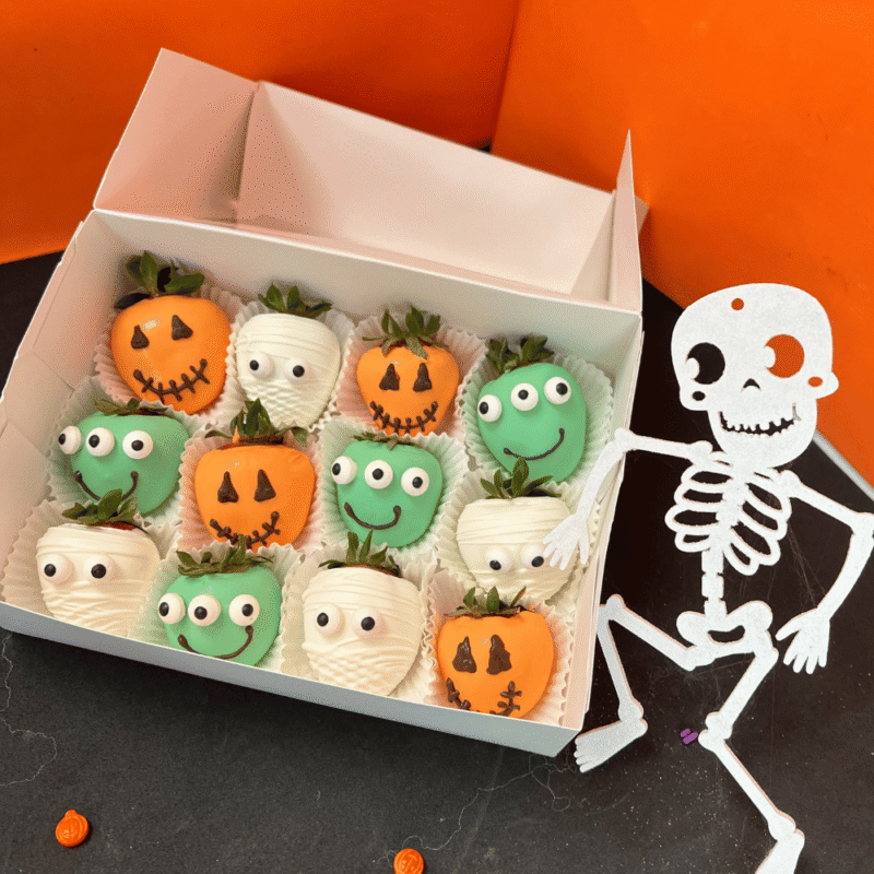 Halloween-themed chocolate-covered strawberries decorated as pumpkins, mummies, and green monsters — handcrafted by Frutidetails Miami