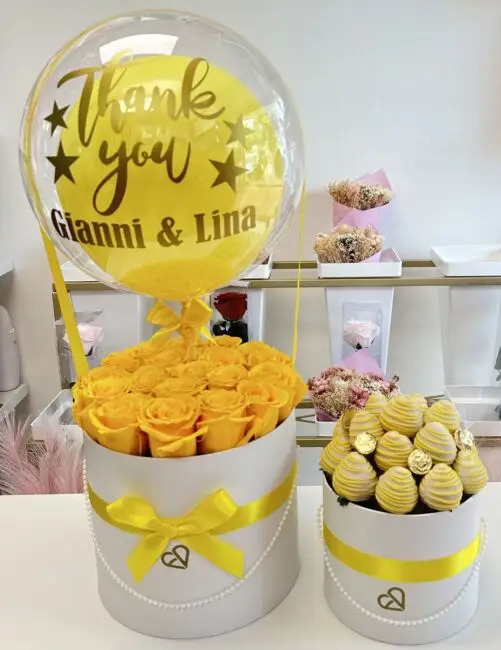 Birthday yellow flowers and chocolate box