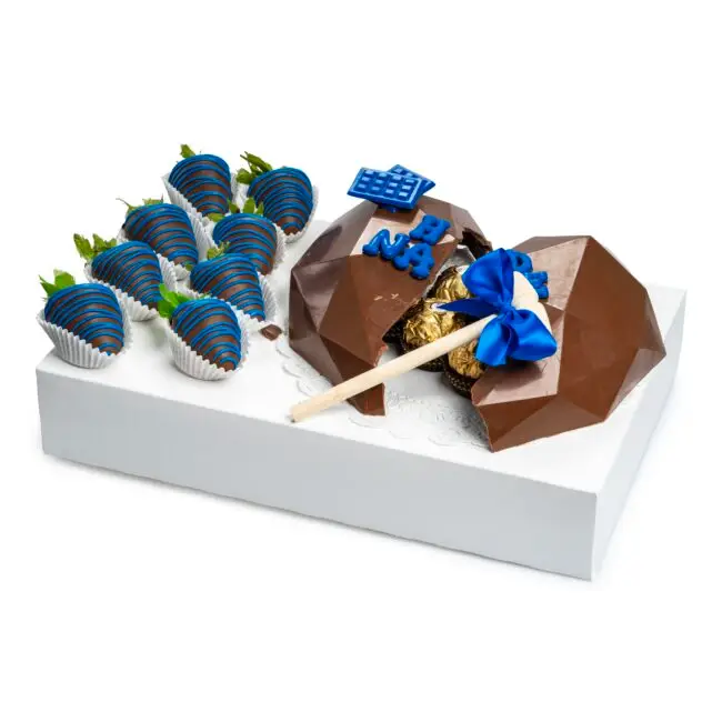 Blue chocolate breakable heart gift box with chocolate-covered strawberries and golden chocolates — handcrafted by Frutidetails Miami.