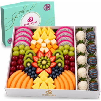 Dragon fruit platter in a white Fruti Details gift box with dragon fruit, pineapple, kiwi, strawberries, grapes, blueberries, cantaloupe, cheese cubes and chocolate-covered strawberries